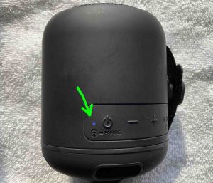 Picture of the speaker, powered ON, showing the Status lamp lit. How to Connect the Sony SRS XB12 to an iPhone.