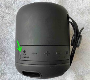 Picture of the Sony SRS XB12 wireless speaker powered OFF, showing the dark Status lamp.