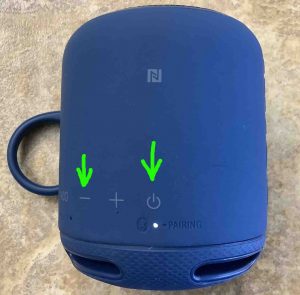 The speaker with the -Volume DOWN- and -Power-buttons highlighted.