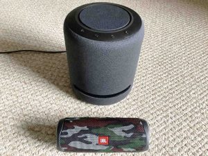 Picture of an Amazon Echo Studio smart speaker with a JBL Flip 5 Bluetooth speaker. How to Reboot Echo Studio Smart Speaker.