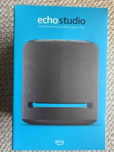 Picture of the front of the original package for the Echo Studio smart speaker.