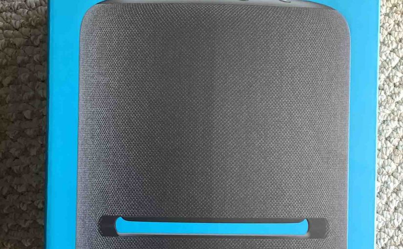 Picture of the front of the original package for the Echo Studio smart speaker.