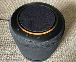 Picture of the Echo Studio speaker in Setup mode, displaying its orange light ring.
