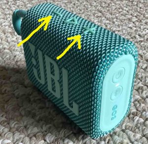 Top view of the JBL Go 3 BT speaker, showing the -Volume- buttons highlighted.