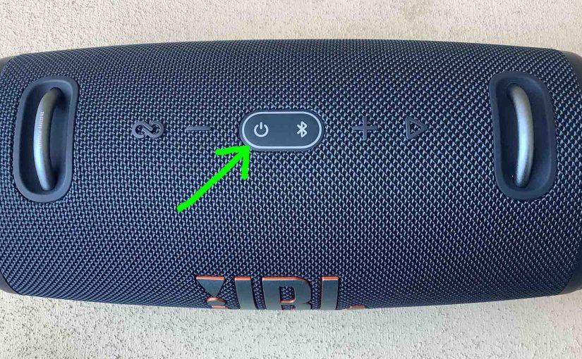 Picture of the dark Power button on the JBL Xtreme 3 speaker.