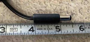 Picture of the DC output plug against a ruler length wise.