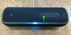 Picture of the Play-Pause / Phone / Voice Assistant button. Sony SRS XB21 Buttons Explained.