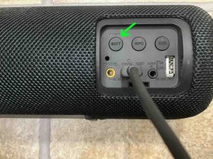 Picture of the -LIGHT BATT- button on the speaker. How to Turn Off Lights on Sony SRS XB41.
