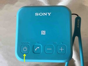 The -Power- button on the Sony X11 tiny personal speaker.