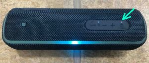 The glowing -Power- light on the Sony SRS XB21 speaker.