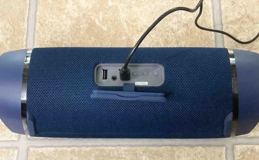 Picture of the back of the Sony SRS XB43 speaker charging, showing the power cord connected.