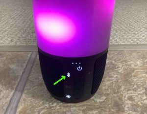 Picture of the glowing Pairing Status light on the JBL Pulse 3 speaker. 