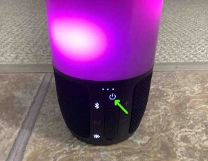 Picture of the glowing Power light on the JBL Pulse 3 speaker.