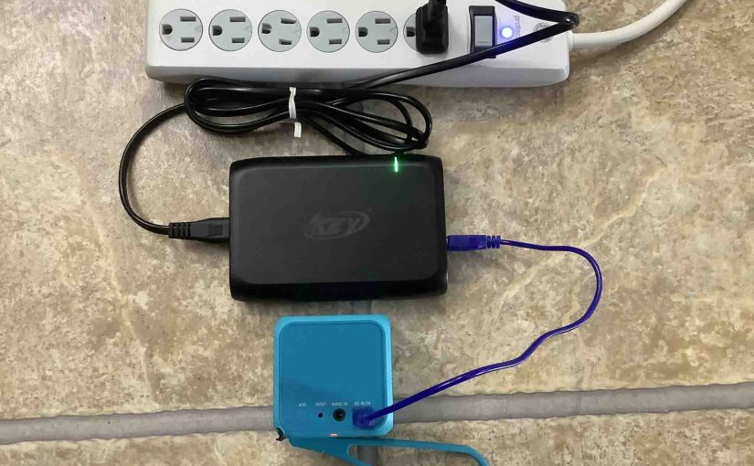 Picture of the Sony SRS X11 speaker connected and charging.