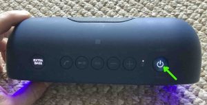 Picture of the glowing Power light. Sony SRS XB20 Buttons Explained.