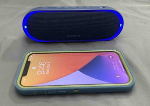 Picture of an iPhone with a Sony XB20.