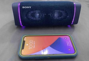Picture of an iPhone with a Sony SRS XB 33.
