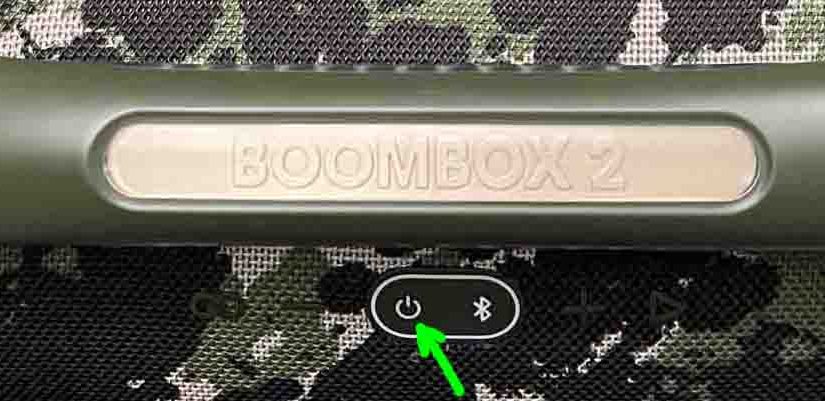 Picture of the dark -Power- button on the JBL Boombox 2 speaker.