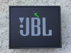 Picture of the blue glowing status light on the front of the JBL Go speaker. Firmware Update Instructions.