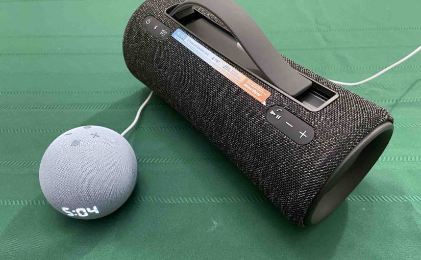 Picture of an Echo Dot 4 speaker clock beside the Sony SRS XG300 boombox speaker.