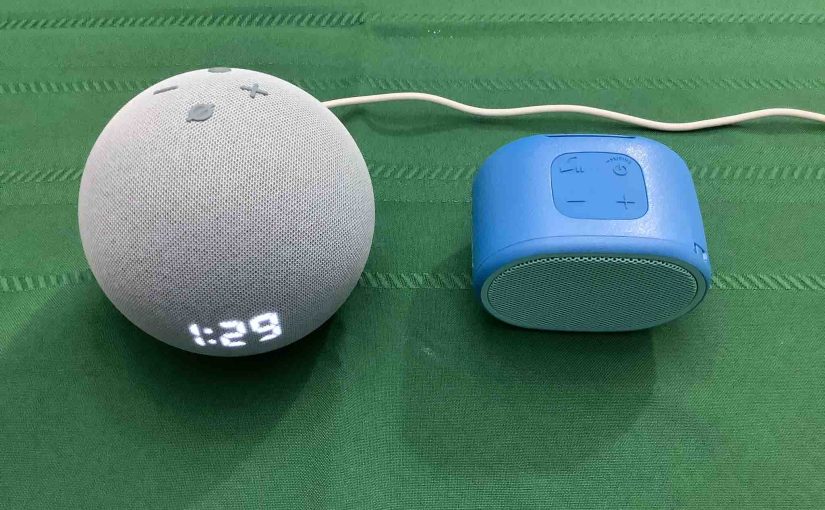 Picture of an Echo Dot 4 speaker clock alongside a Sony SRS XB01 speaker.