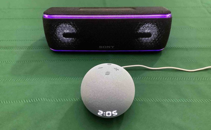 Picture of an Echo Dot 4 clock speaker in front of a Sony SRS XB41 BT speaker.