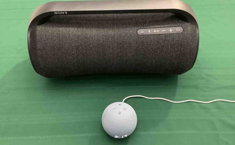 Picture of an Echo Dot 4 clock speaker in front of a Sony SRS XG500 boombox speaker.