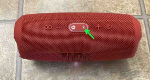 Picture of the dark Bluetooth Pairing button on the JBL Charge 5 speaker.