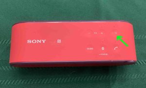 Picture of the Power button on the Sony SRS X2.