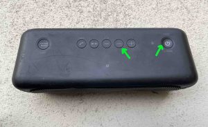 Picture of the Volume Down and Power-Pairing buttons on the Sony SRS XB40 speaker.