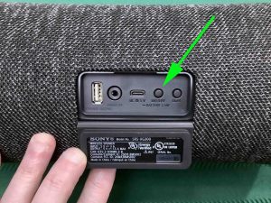 Picture of the Battery-Battery Care button on the back of the Sony SRS XG300 speaker.