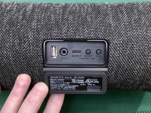 Picture of the ports door held open on the Sony SRS XG300 boombox speaker.