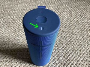 Picture of the Power button glowing on the UE Megaboom 3 BT speaker.
