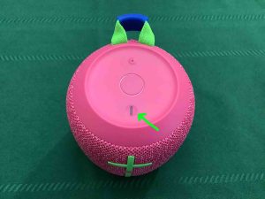 Picture of the top of the UE Wonderboom 3 BT speaker. showing the dark Power button.