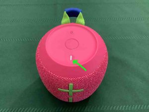 Picture of the UE Wonderboom 3 speaker glowing Power button.