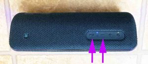 Screenshot of the Play-Pause and Volume Down buttons on the Sony SRS XB32 speaker.