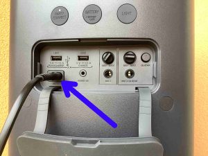 Picture of the charging cable plugged into the AC input port on the Sony XP500.