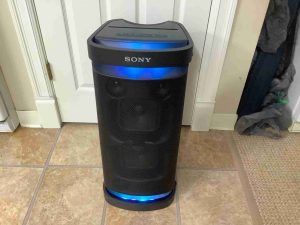 Picture of the front of the Sony SRS XP700, showing the party lights glowing blue.