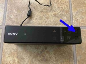 Picture of the Power button on the top of the Sony X 5.