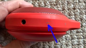 Picture of the JBL Clip right side. Showing the -Volume DOWN- button.